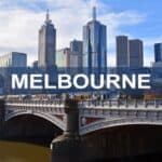 Melbourne city skyline featuring iconic skyscrapers and the Yarra River bridge, showcasing Australia's vibrant business hub and modern architecture.